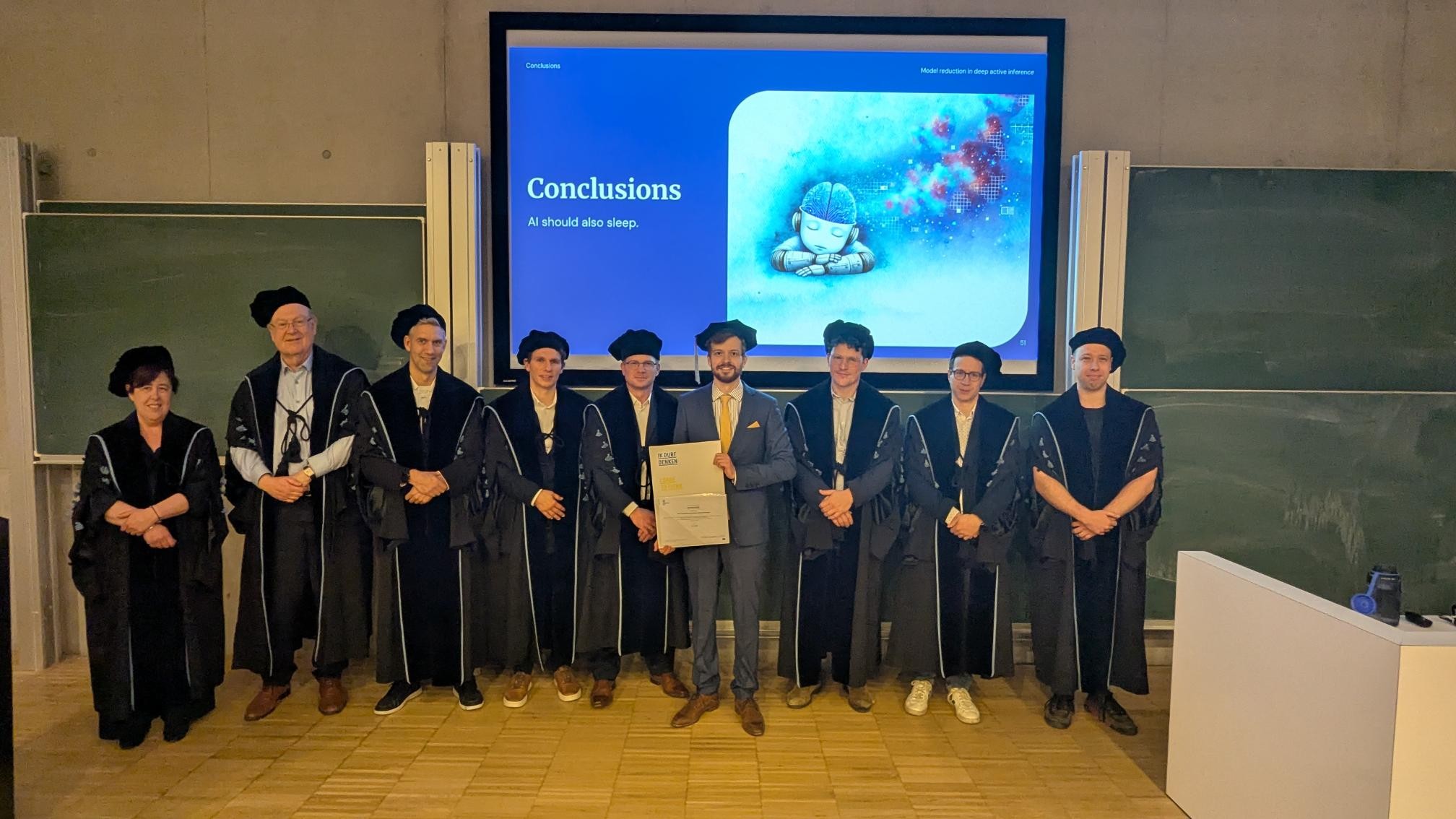 Samuel Wauthier and the jury after receiving his PhD degree in Computer Science